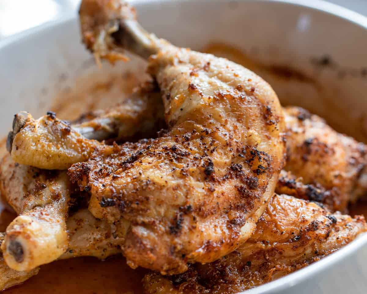 a piece of baked chicken leg quarter