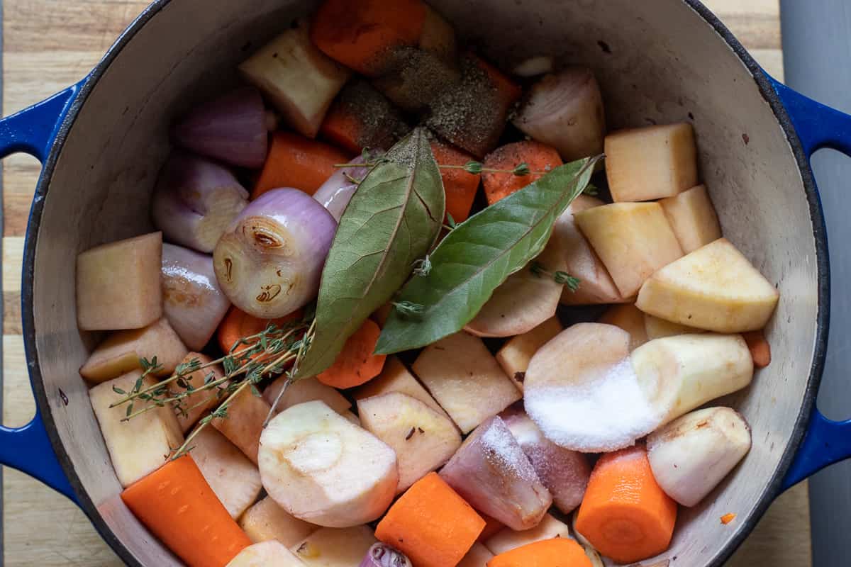 red wine and herbs are added to the pan