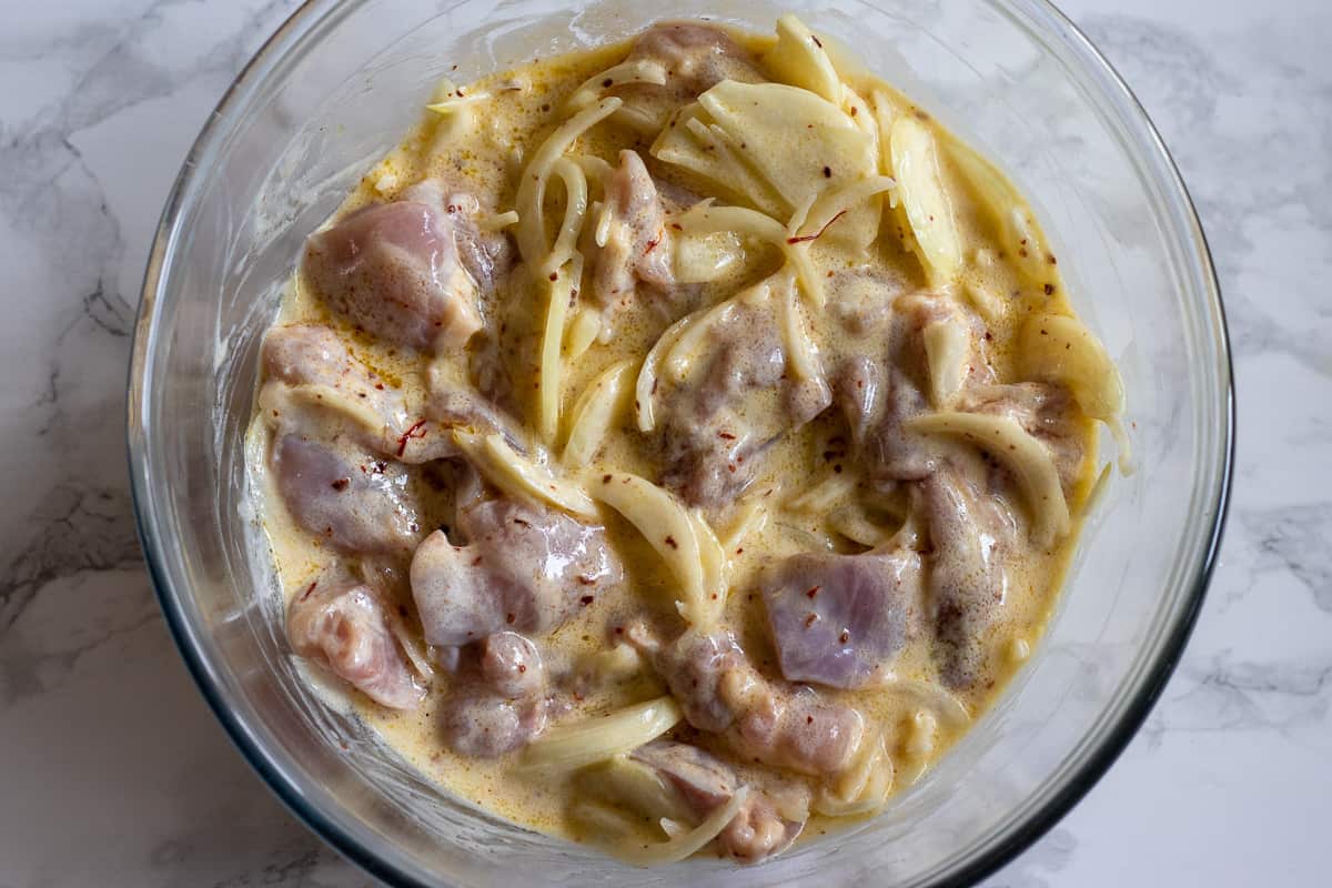 chicken pieces are added to the bowl