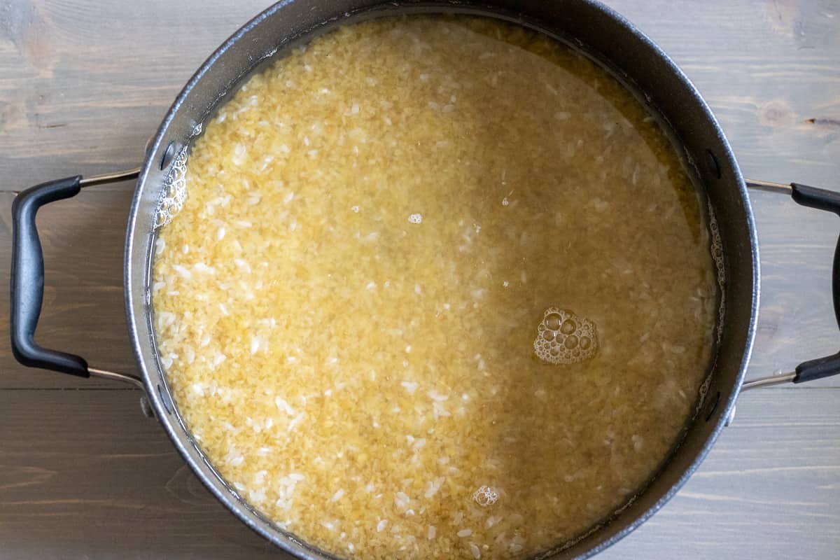 bulgur and rice are placed in a pot with water