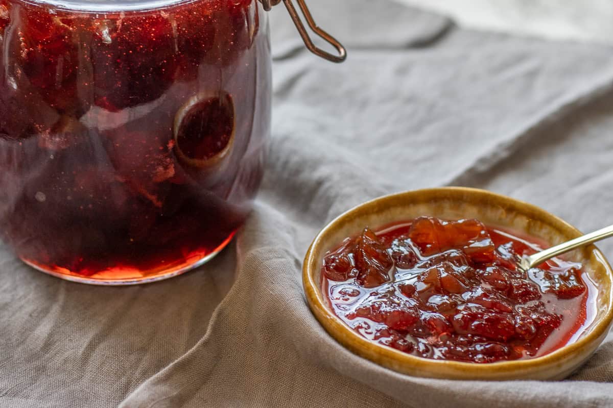 Jam served in a small bowl and a jar.
