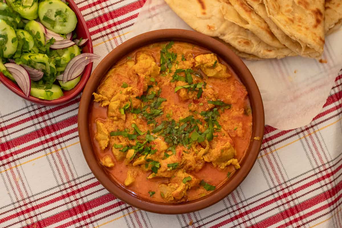 easy chicken handi served with guyanese roti