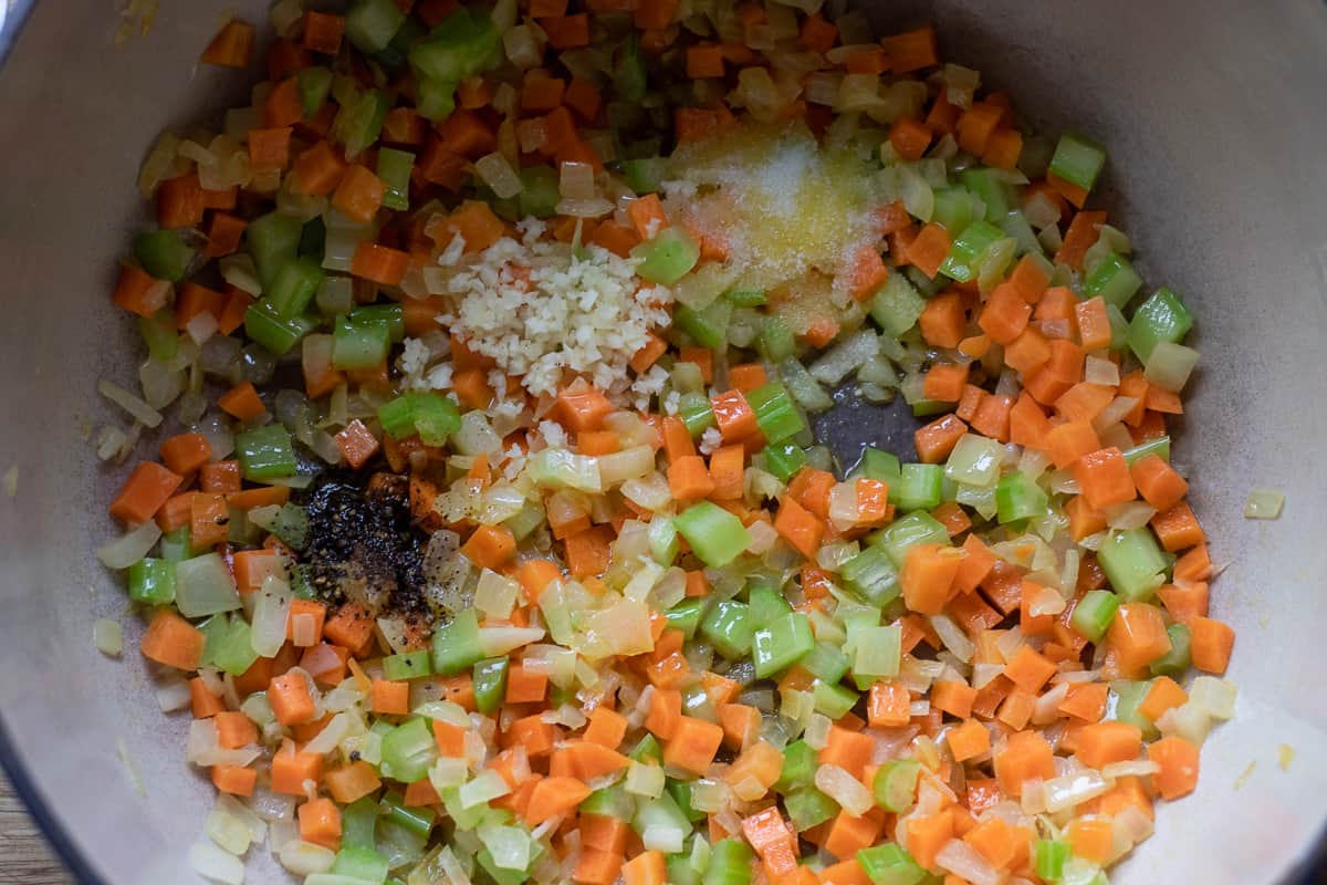 garlic, salt and pepper are added to the pot