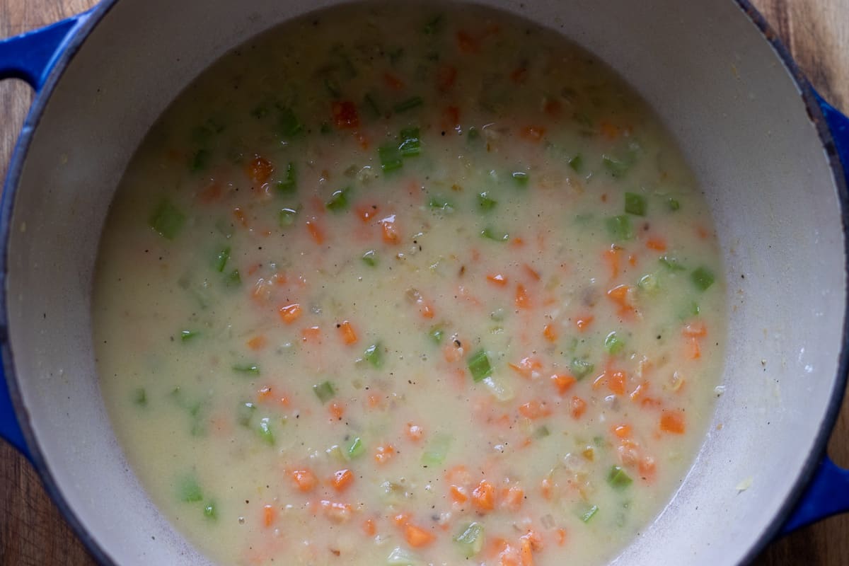 chicken stock is added gradually to the vegetables to create a roux