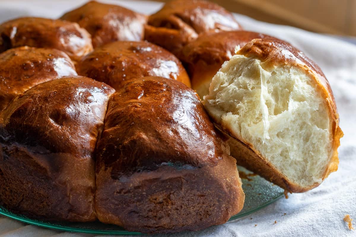 a piece of milk bun teared from the rest