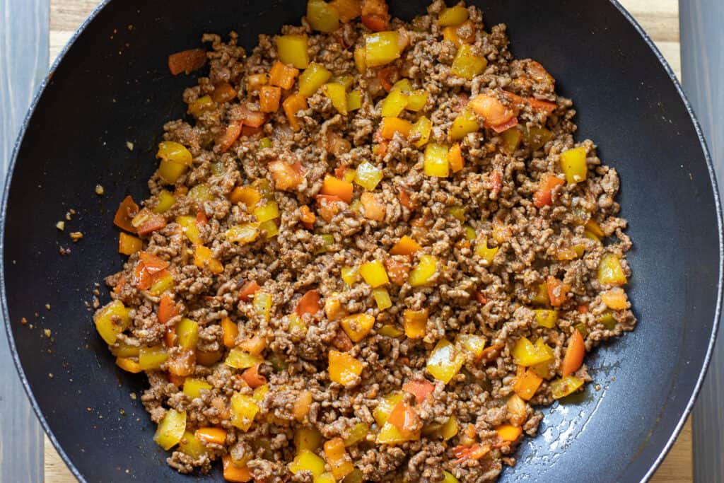 Ground beef filling for tacos is ready to fill the tortilla wraps.