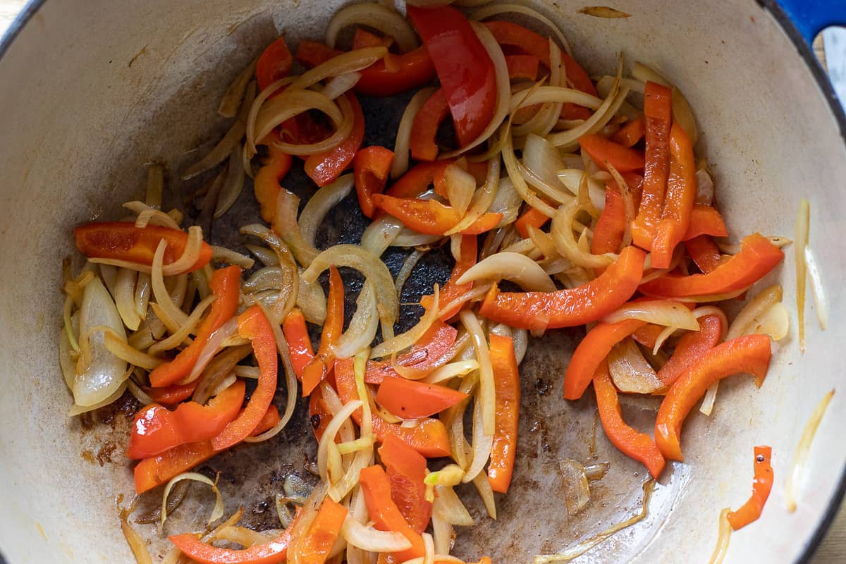 sautéing onions and peppers in Dutch oven
