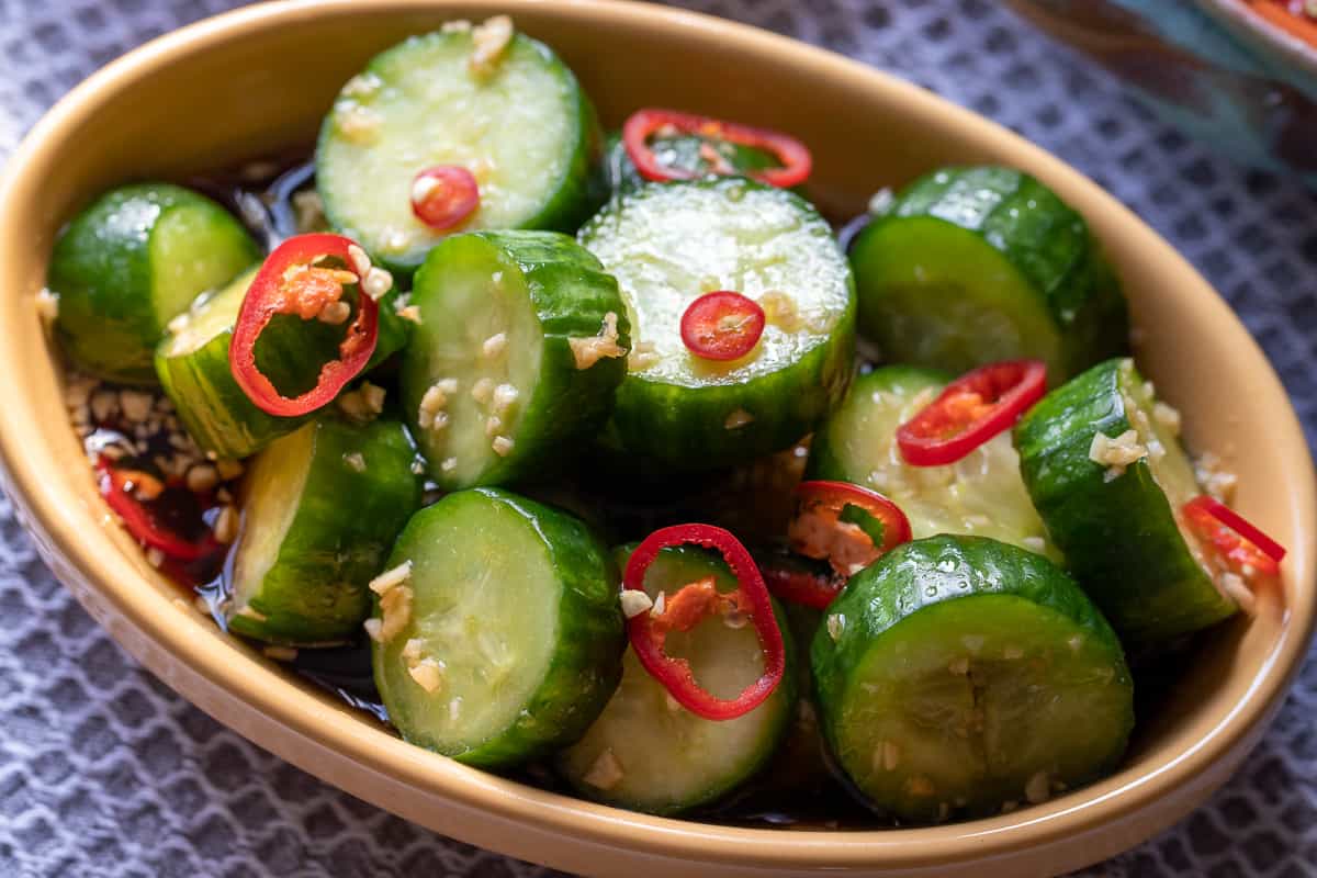 din tai fung salad garnished with red chilies
