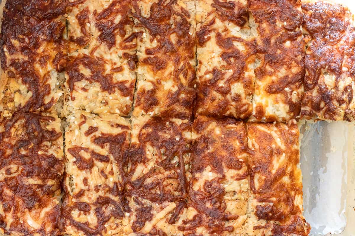 The bread is sliced after allowing it to cool down slightly.