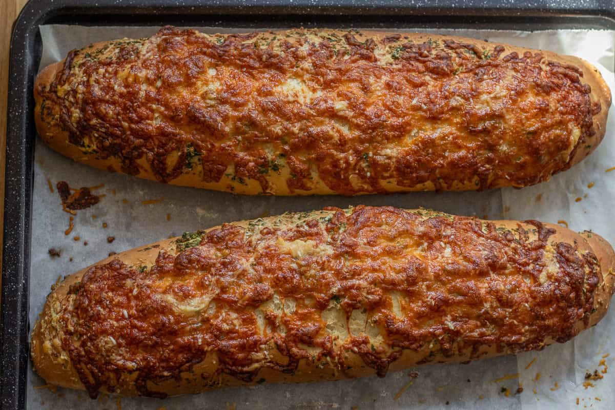 2 cheese bread loaves baked until golden and crispy on the outside.