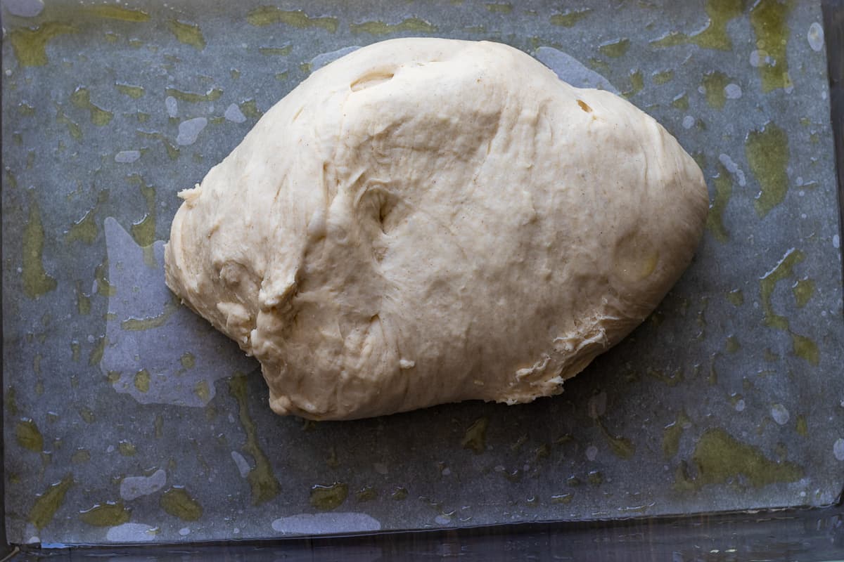 the dough is placed in a lightly greased baking dish