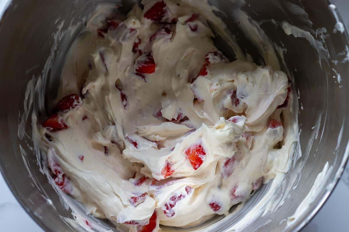 chopped strawberries are mixed with mascarpone filling