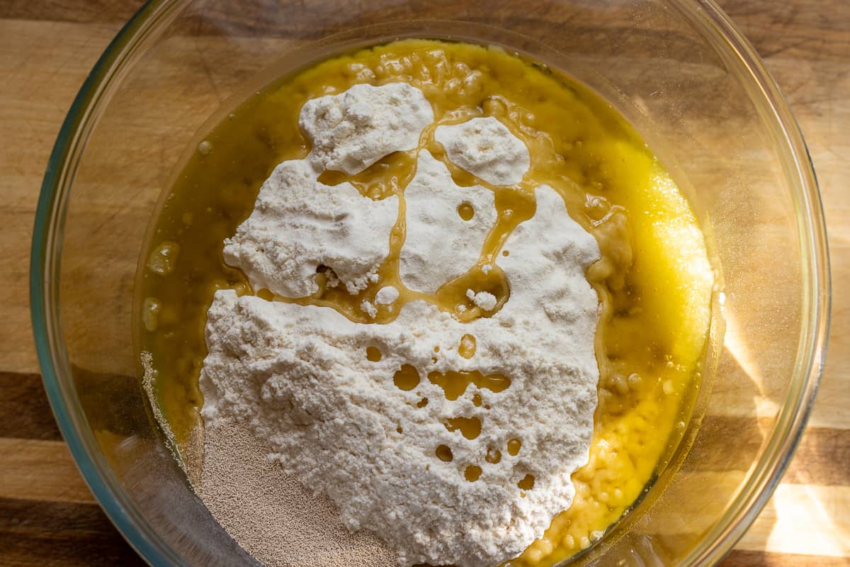 flour, salt, yeast and olive oil are placed in a bowl