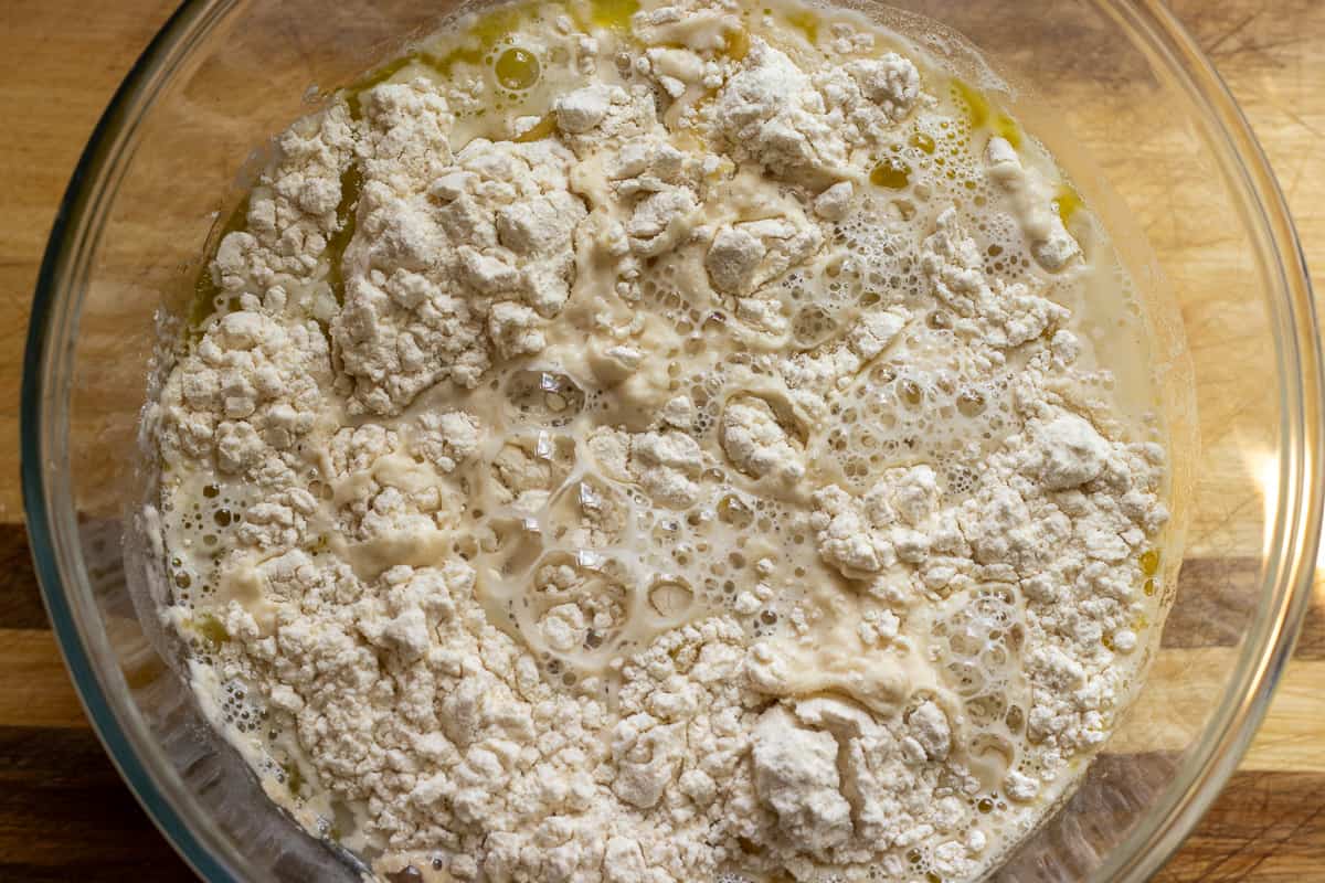 ingredients for fatayer dough are placed in a bowl