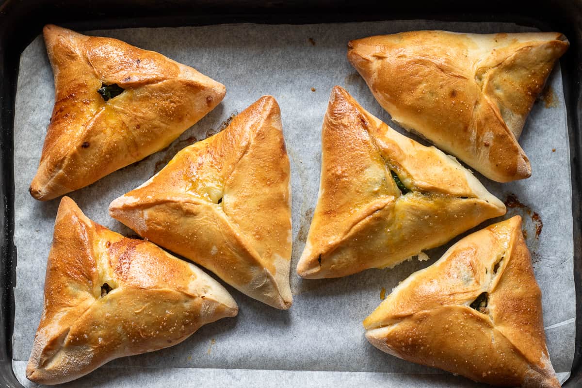6 pieces of triangle shaped Lebanese fatayer pies
