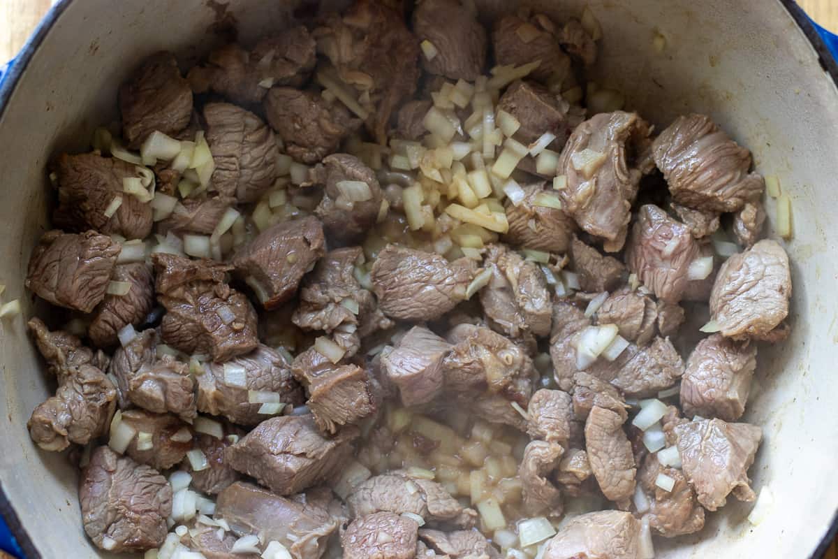 sautéing the onions with lamb
