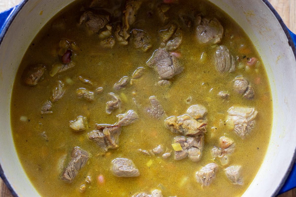 water is added to sautéed onions and lamb