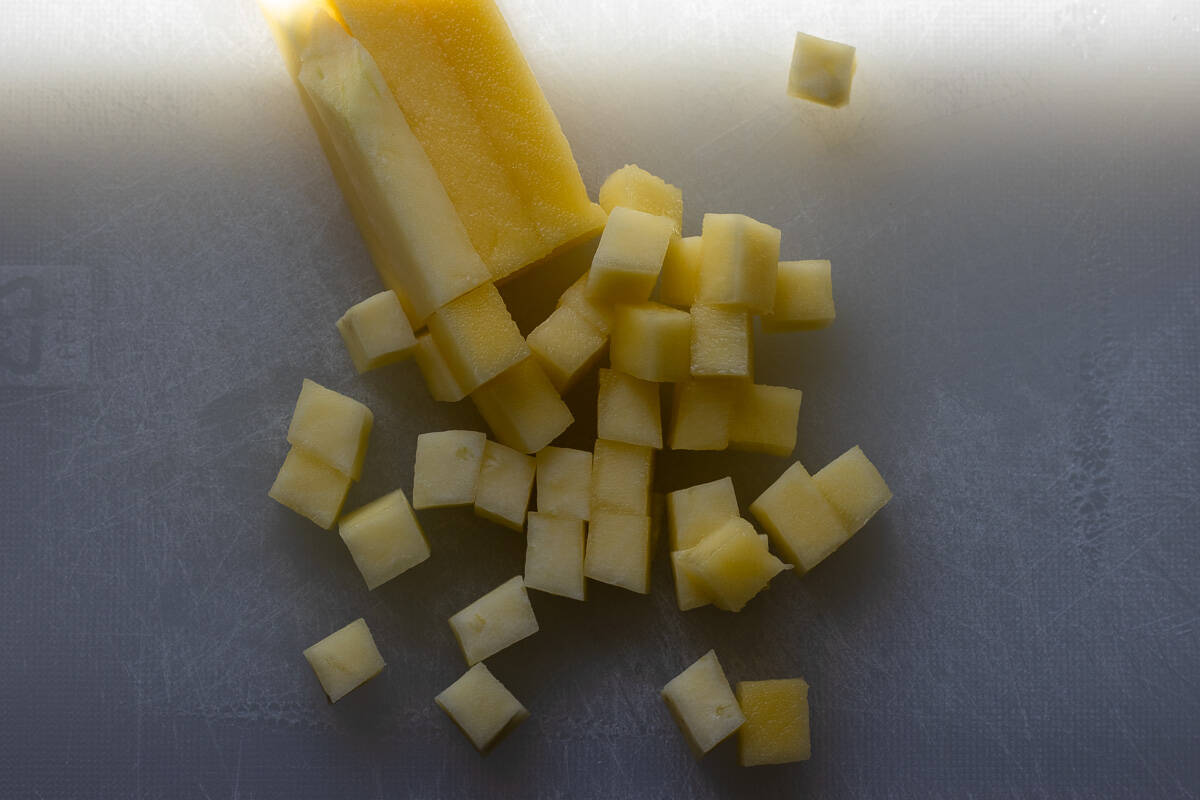 mango strips are cut into dices