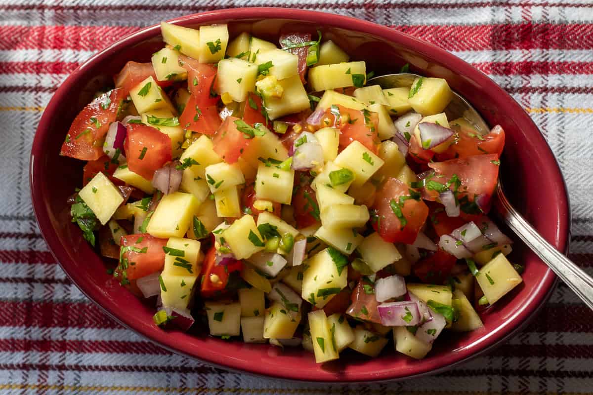 mango pico de Gallo a.k.a fresh mango salsa is served in a small bowl