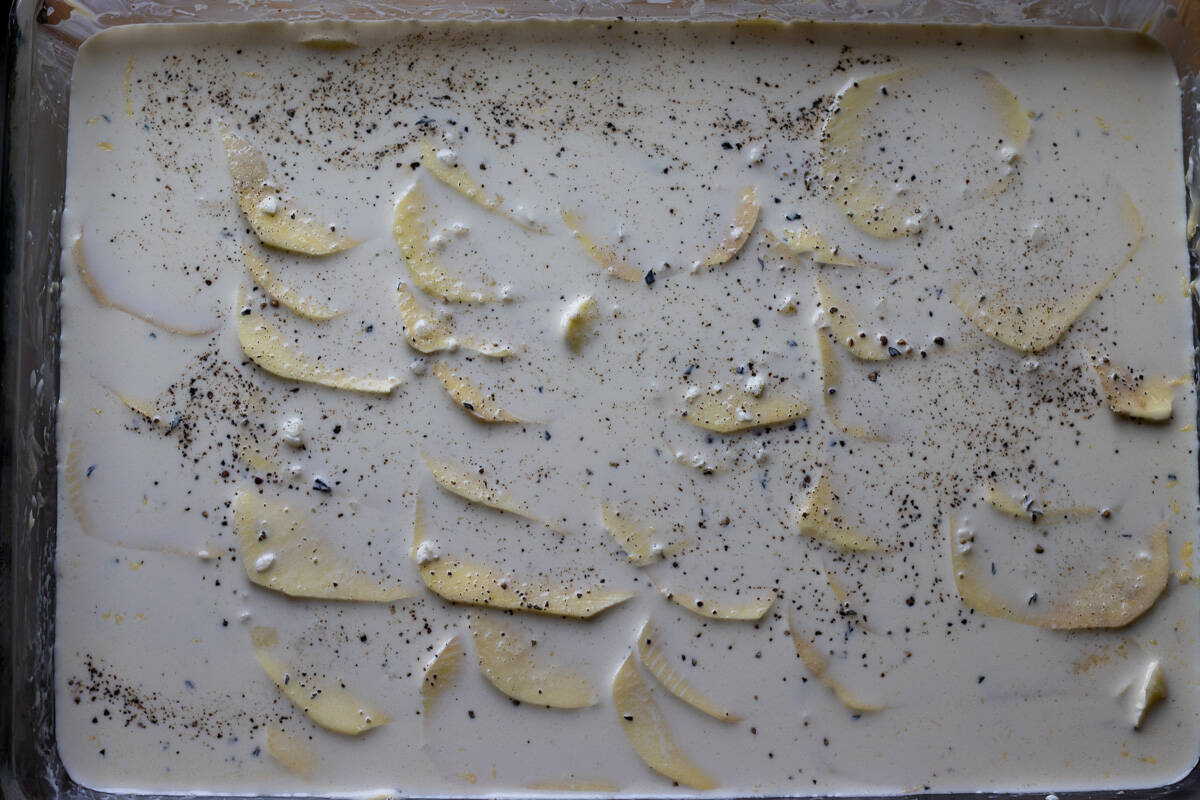 all the potatoes are layered in a baking dish