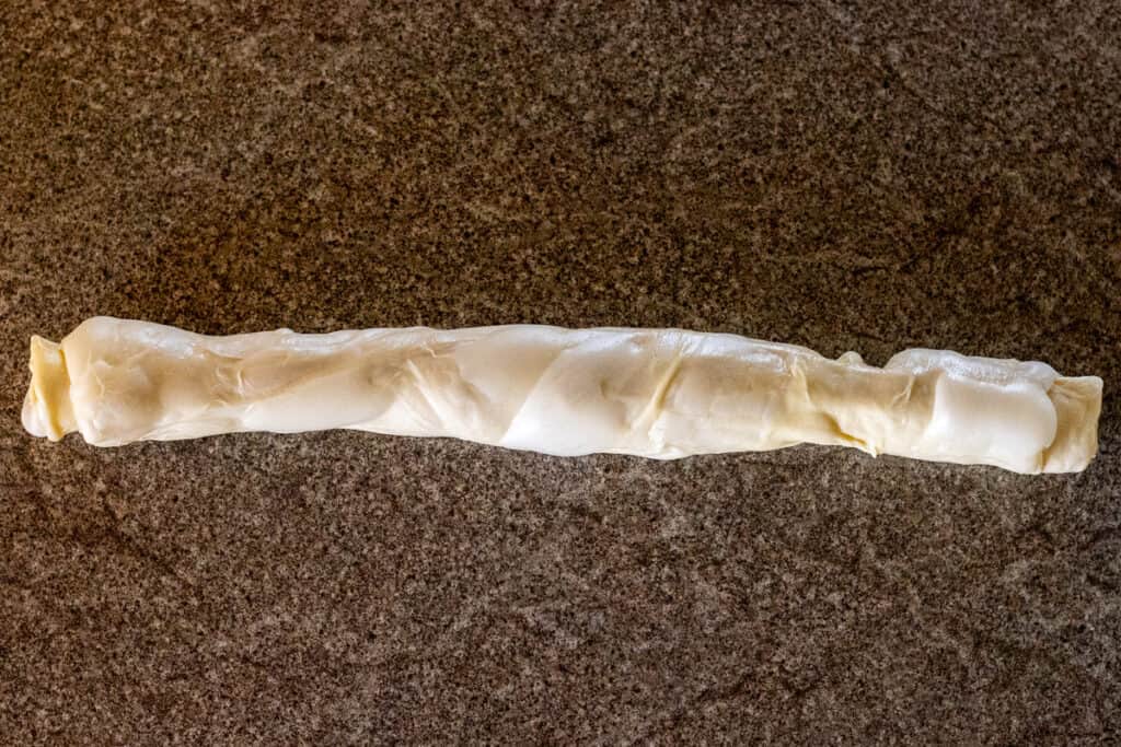 the dough has been rolled into a log shape