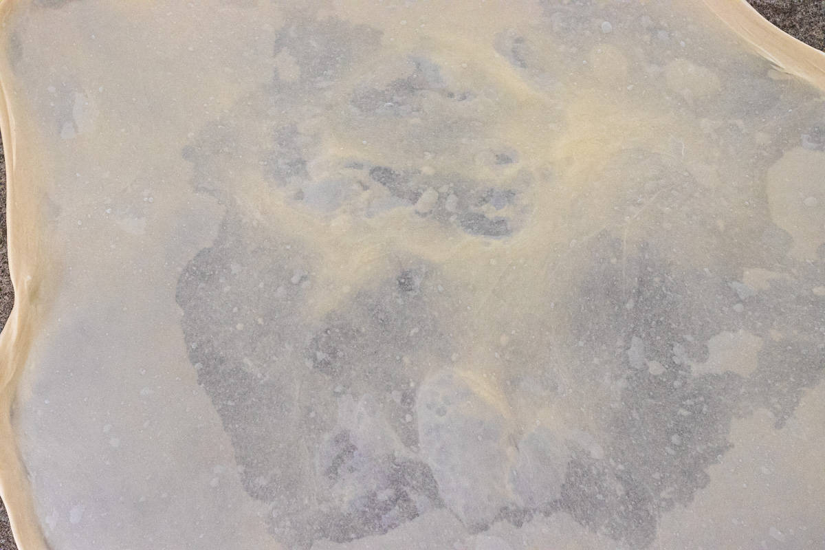 dough circled is stretched until paper thin