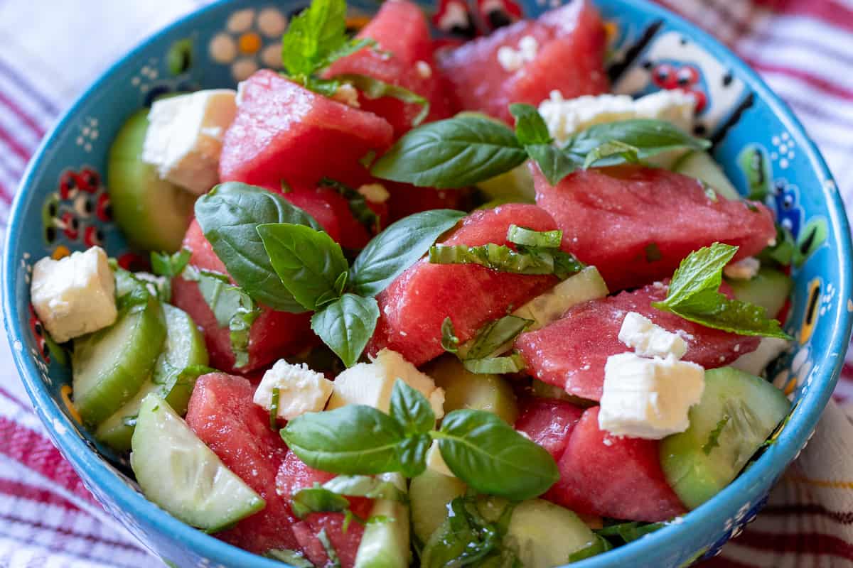 watermelon salad with feta cheese, cucumbers, and basil
