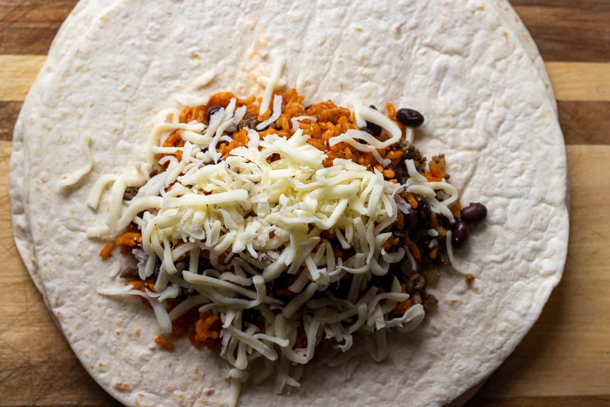 shredded cheese is added to the Mexican rice