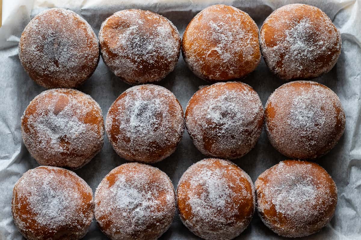 doughnuts are covered with caster sugar