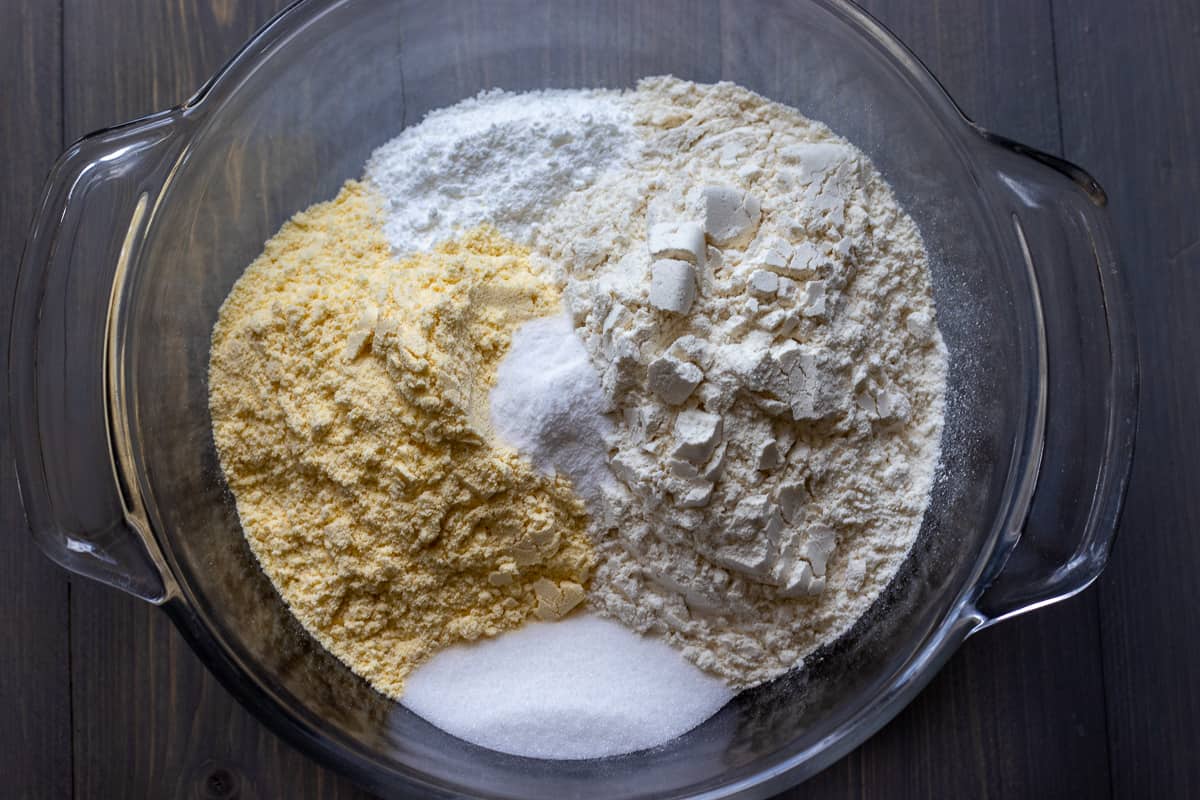 dry ingredients for Mexican cornbread are placed in a bowl