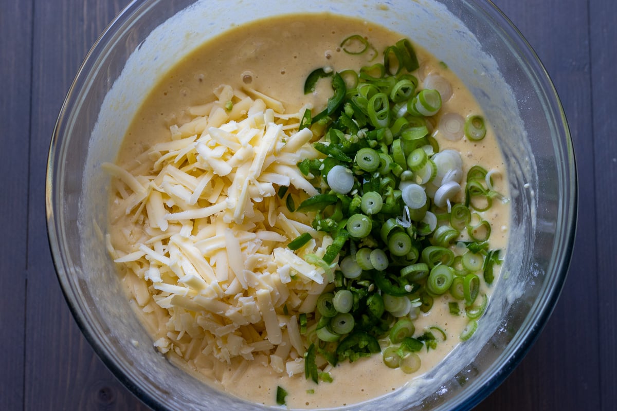 sliced onions, cheese, and jalapenos are added to the bread mixture
