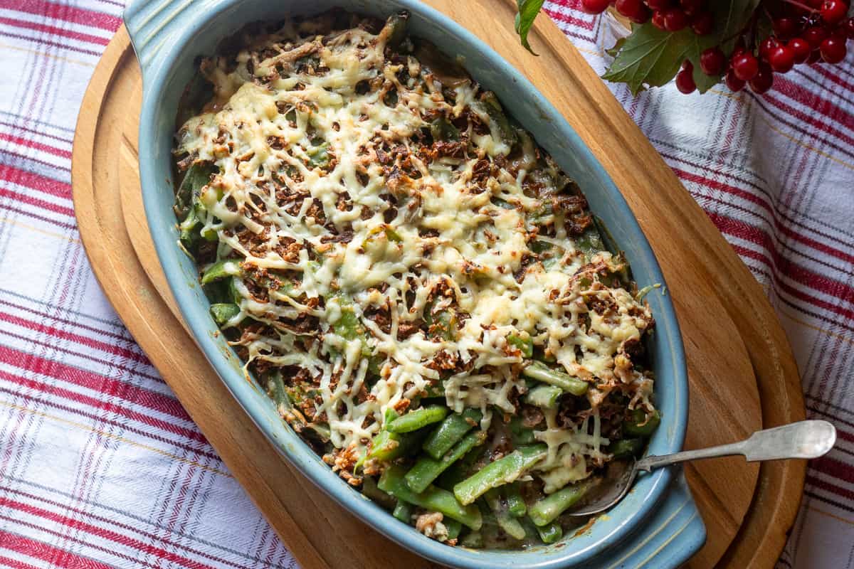 green bean casserole is baked until the cheese is golden and bubbly