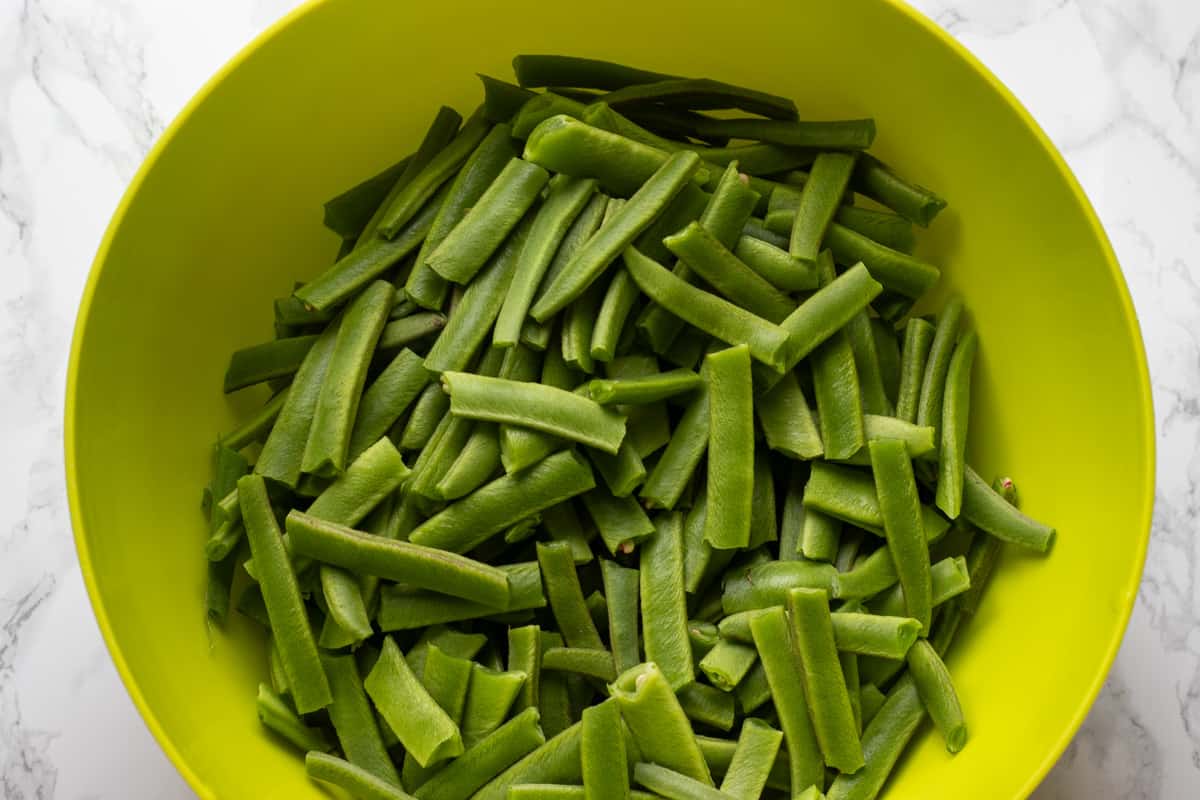 green beans are trimmed and cut for making green bean casserole