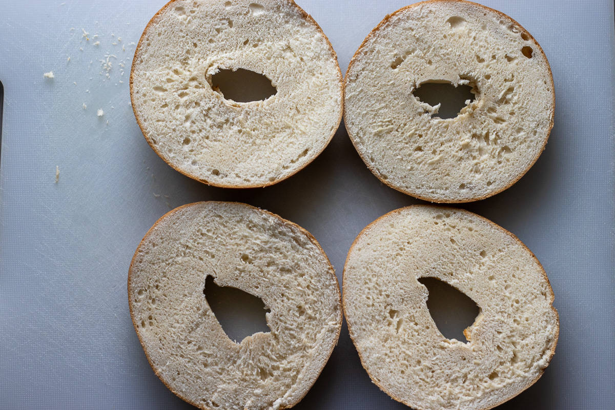 2 bagels are cut in halves