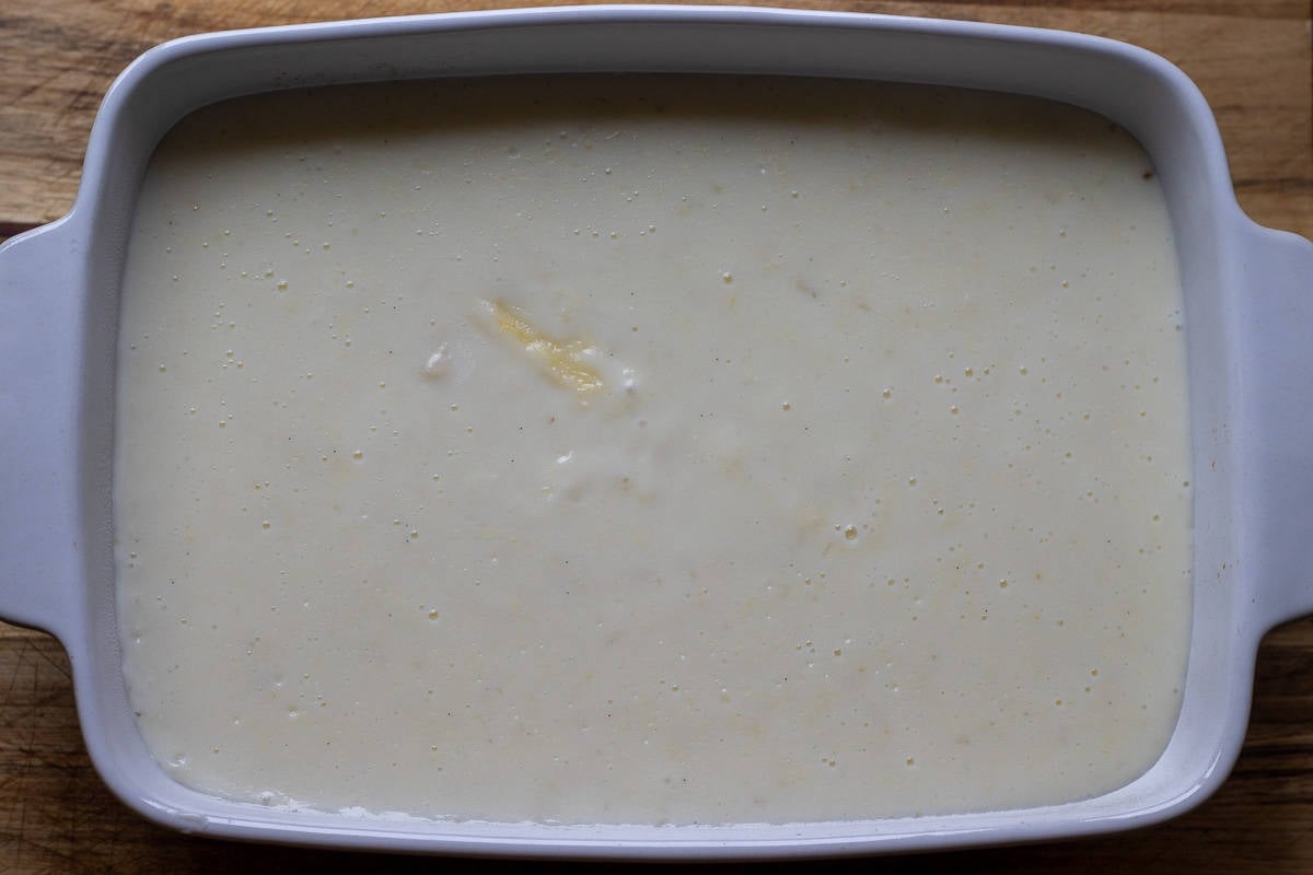 the custard is poured in a baking dish