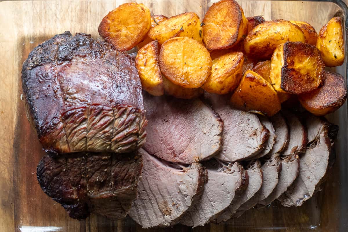sliced roast beef with roast potatoes