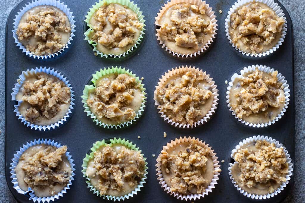 12 muffins are topped with streusel.