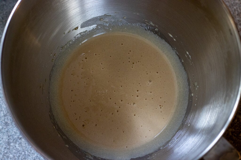 egg, brown sugar, and caster sugar are mixed in a bowl