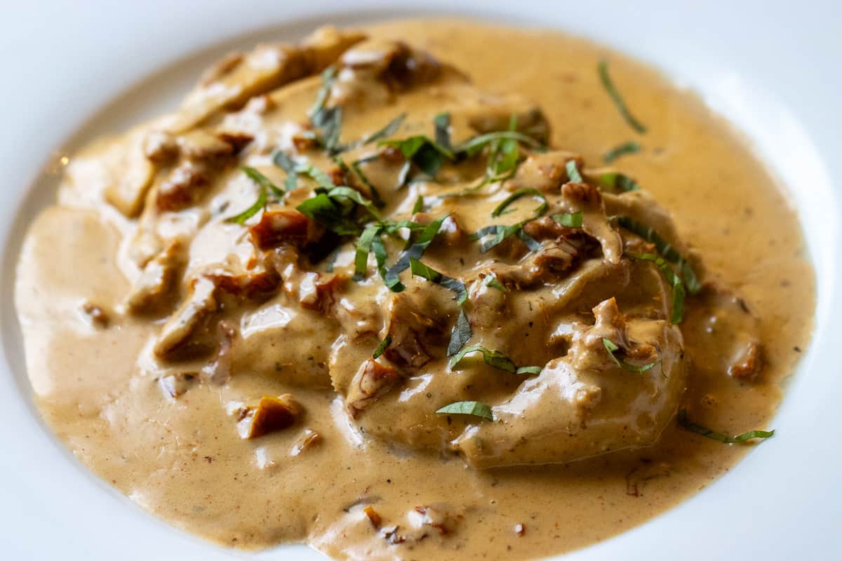 marry me chicken garnished with basil