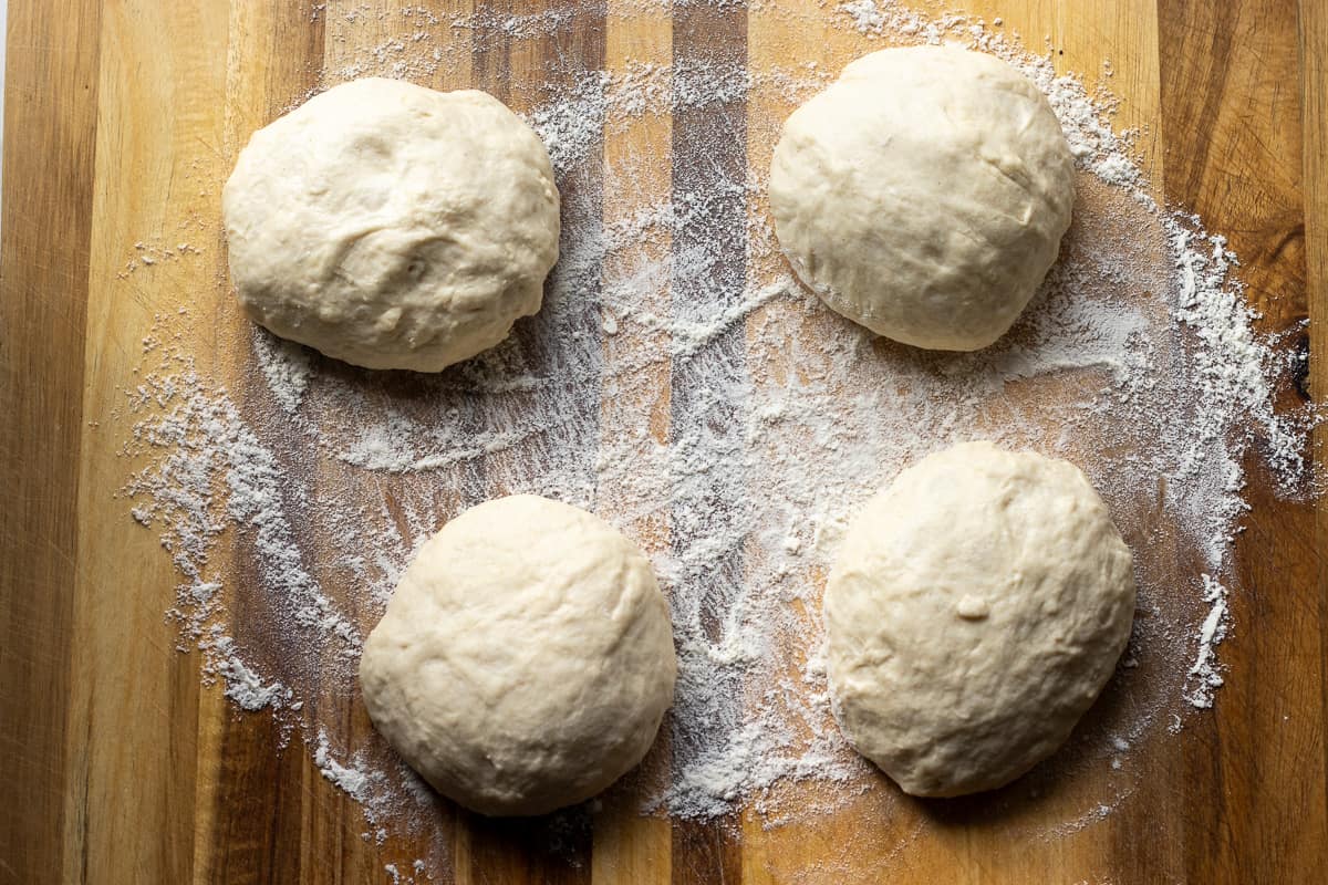 Naan dough is divided into 4equal balls.