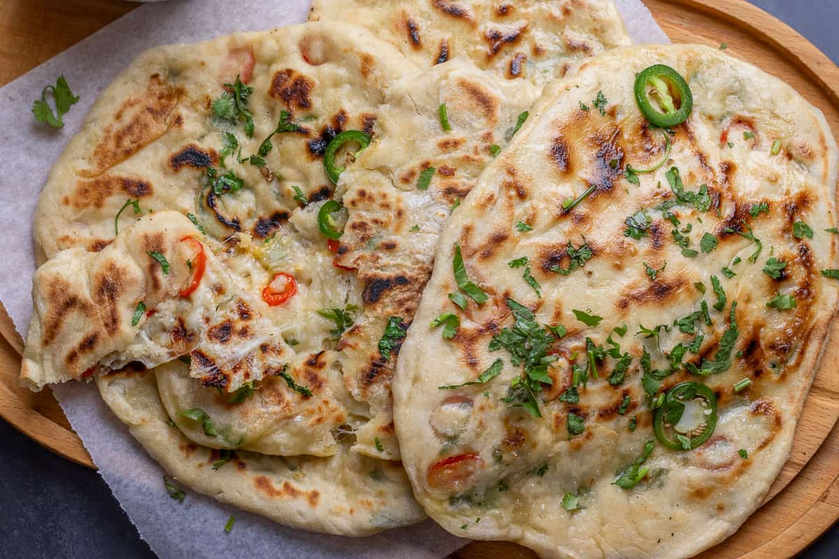 4 pieces of spicy and cheesy Indian flat bread.
