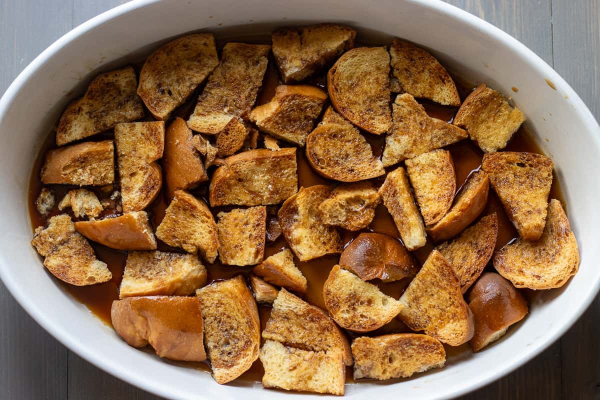bollilo bread soaked in syrup and placed in a baking dish