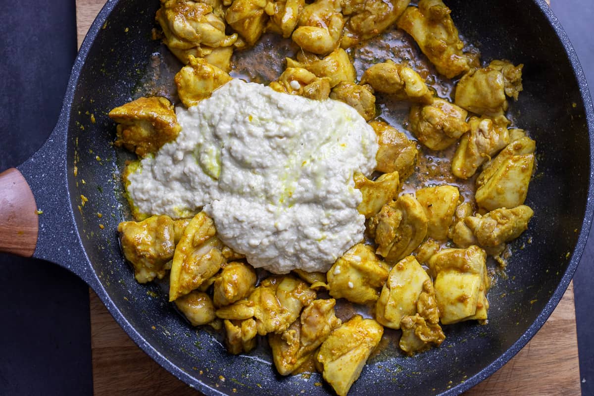 creamy sauce is added to sautéed chicken