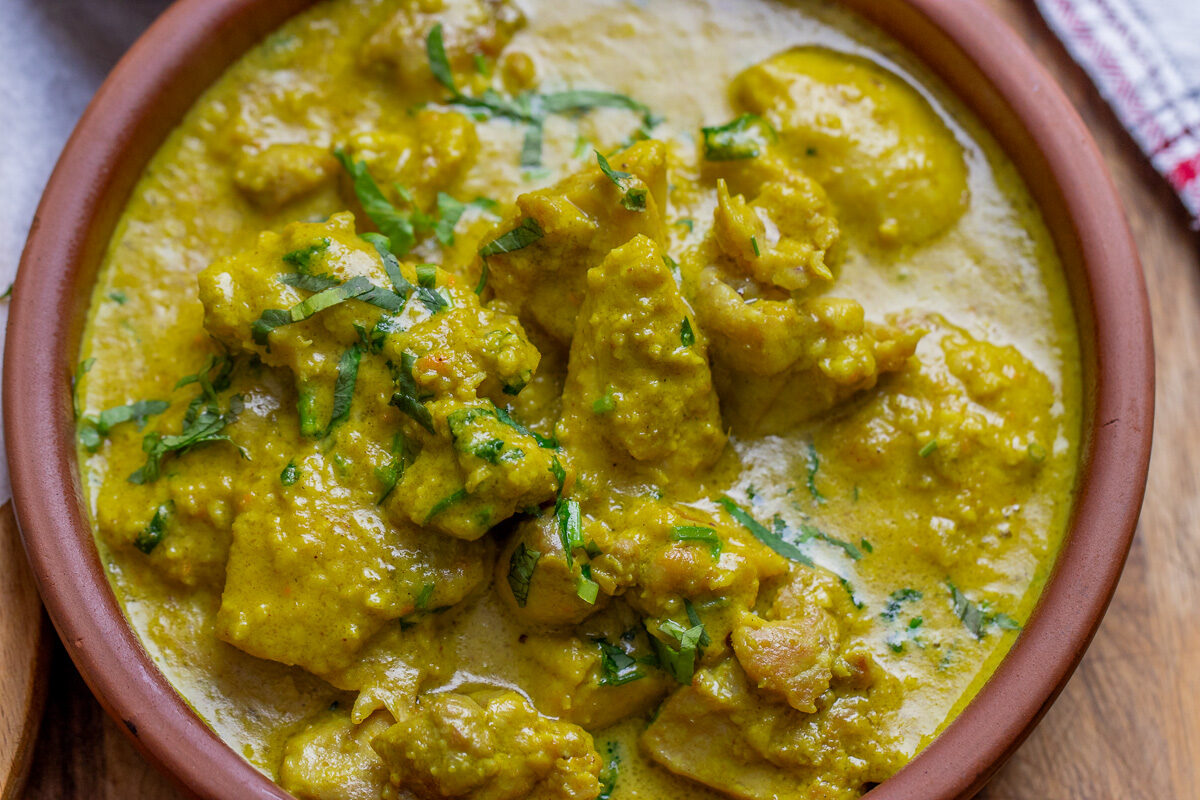 creamy chicken korma garnished with coriander