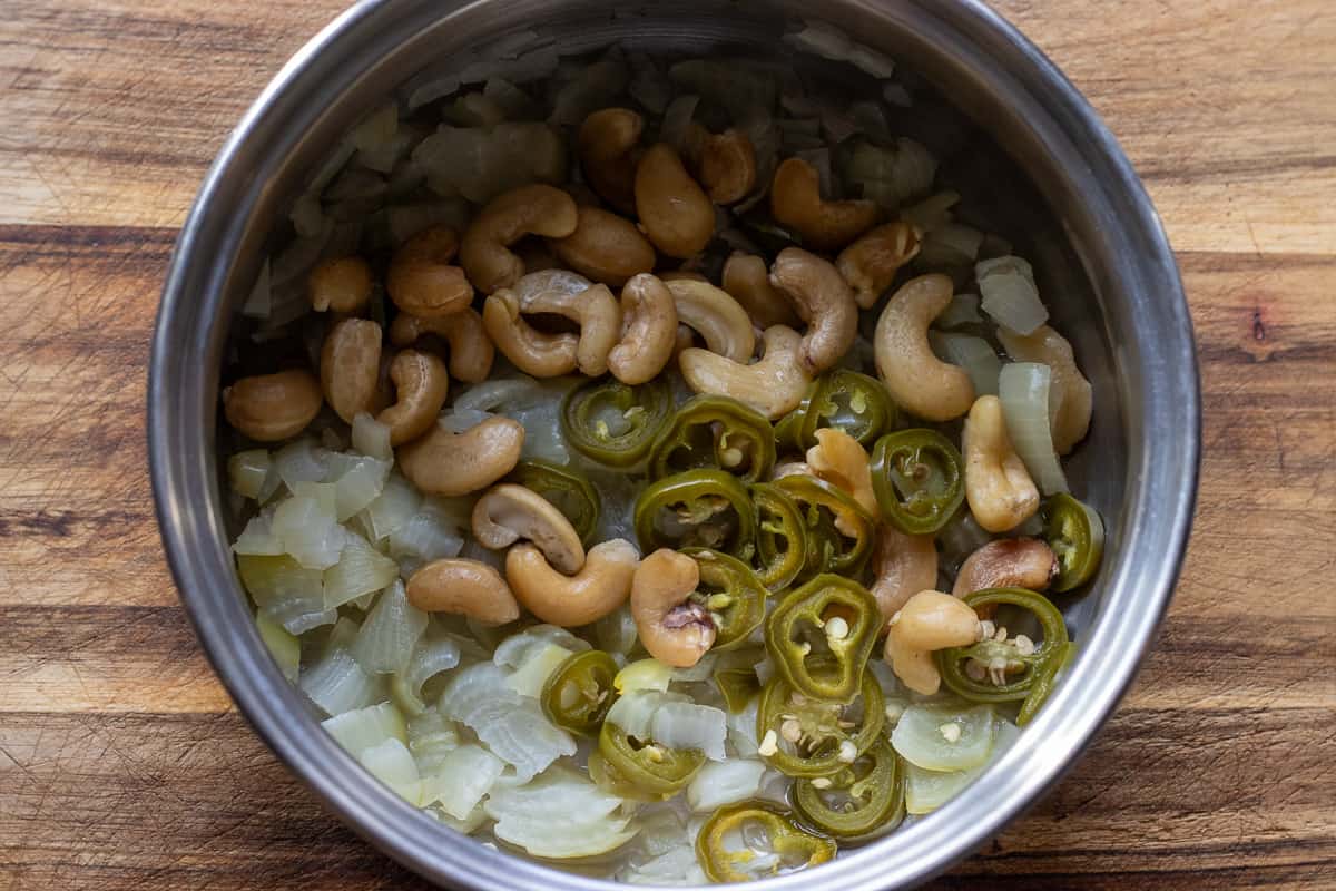 onions, chili and cashew nuts are cooked for 10 minutes