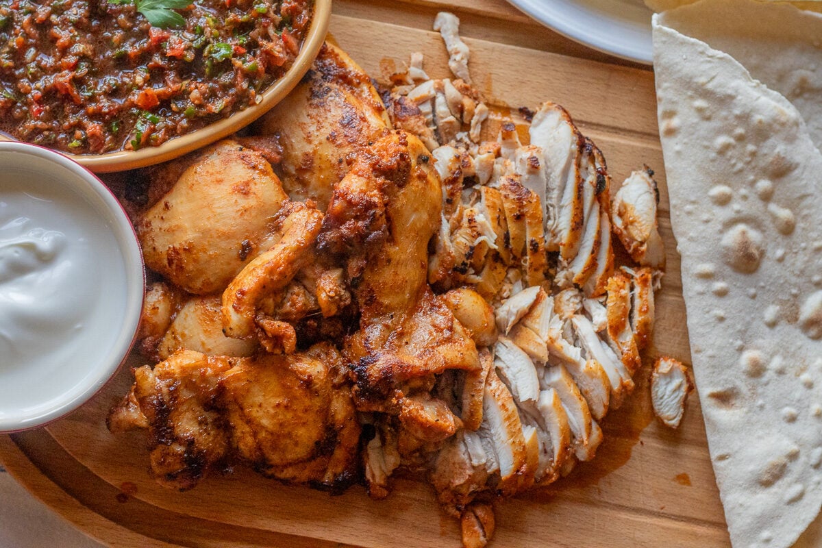 Lebanese chicken shawarma served with pita bread and yogurt sauce