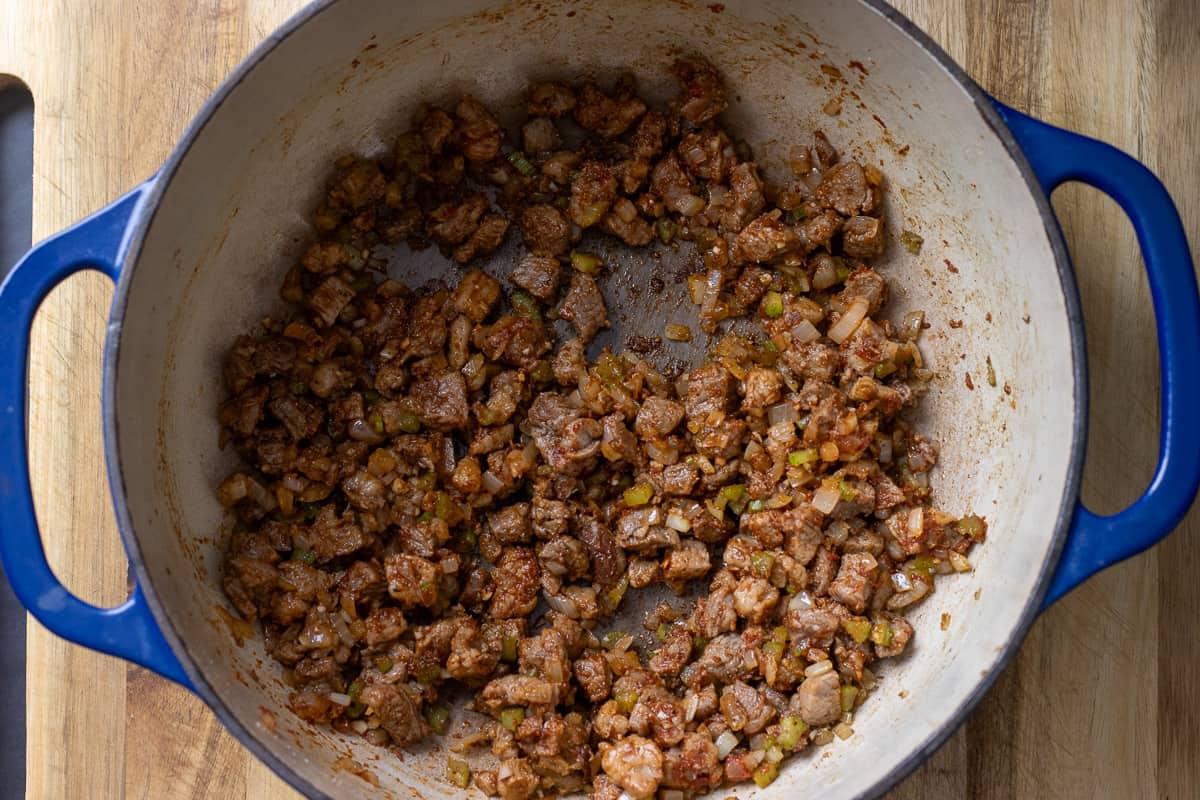 tomato paste is added to the pan