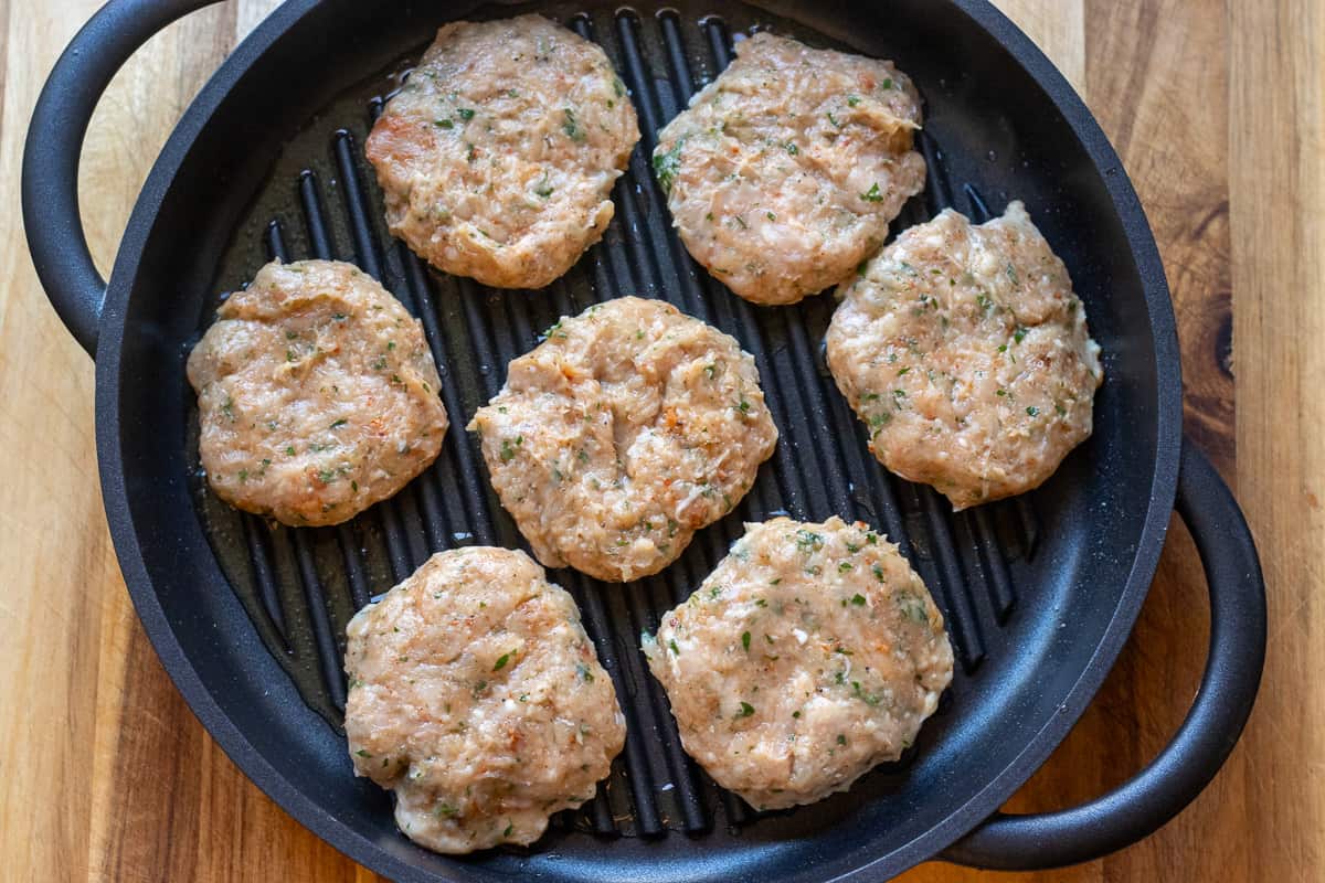 7 pieces of chicken kafta on a grill pan