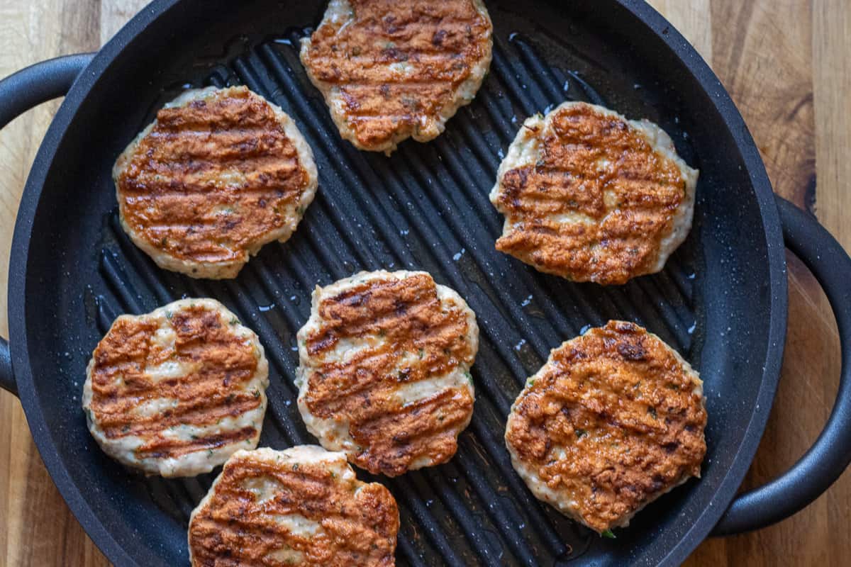 chicken patties are cooked until golden brown