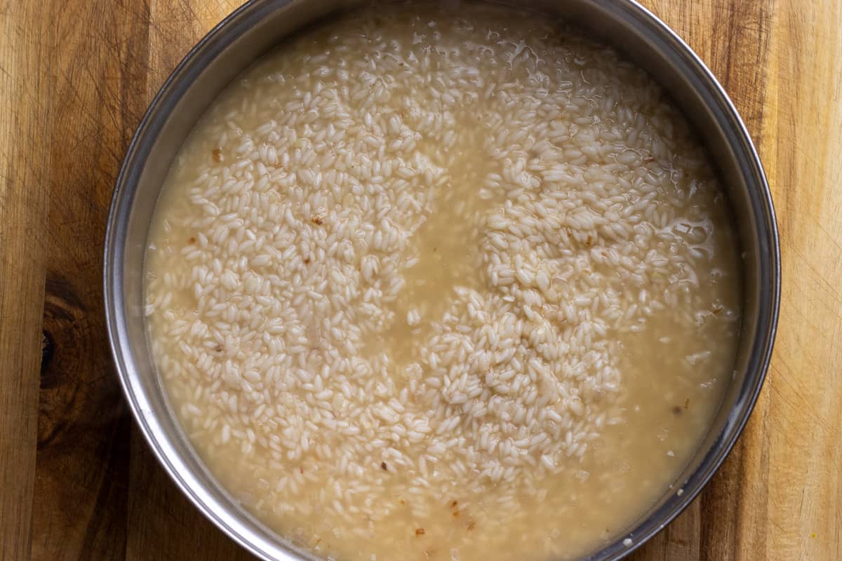 adding stock to cauliflower risotto